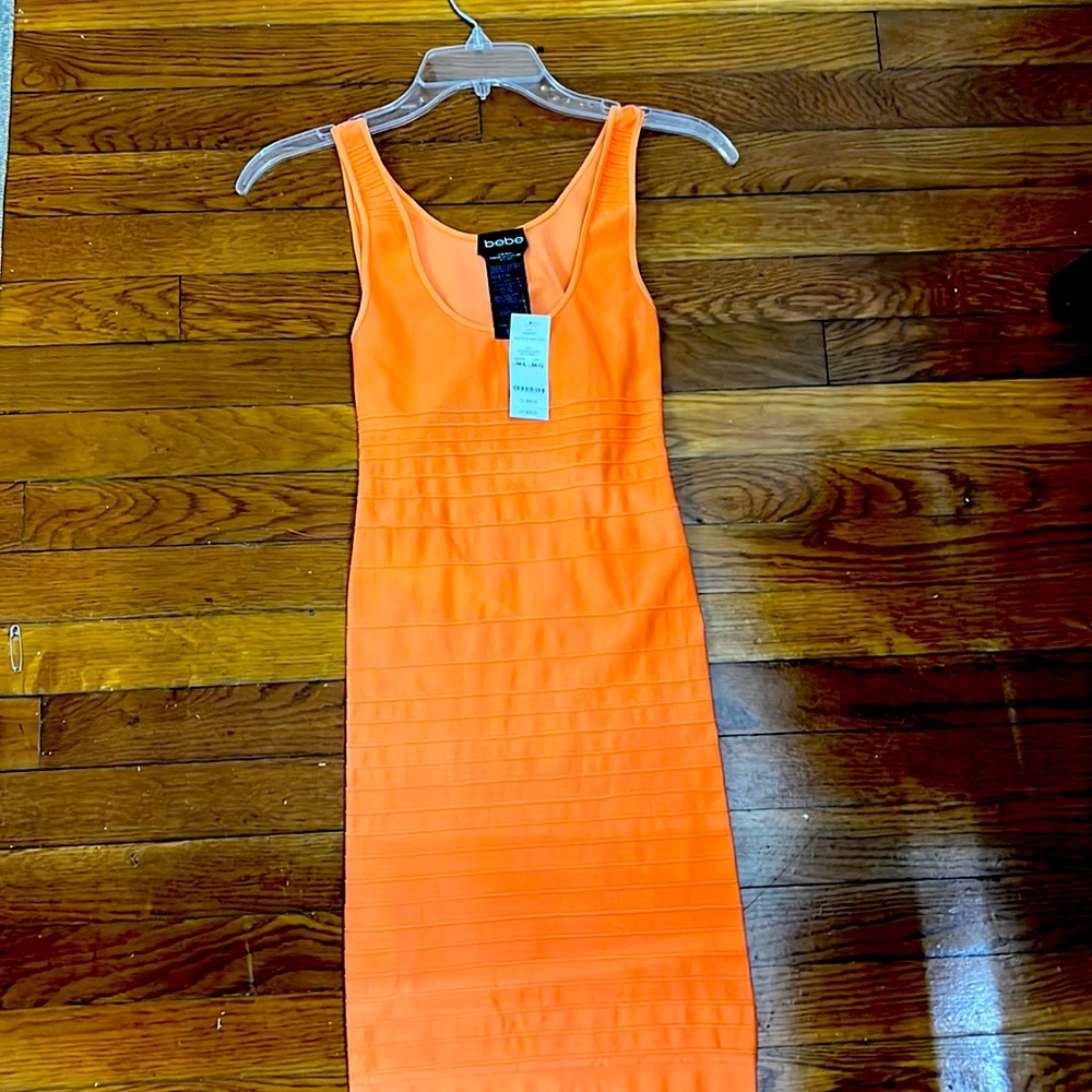 A beautiful dress with some of the back out like a circle.
